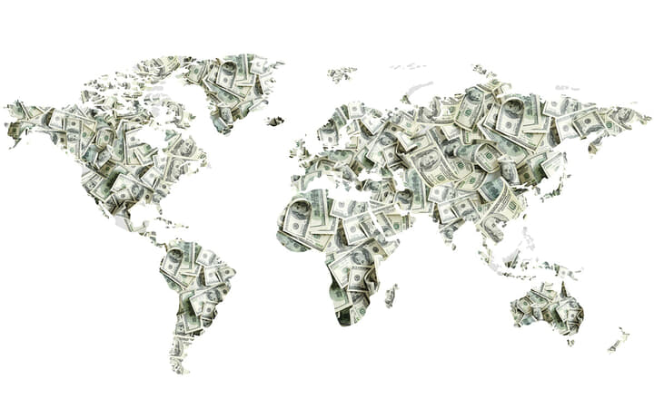 ドル札と世界地図